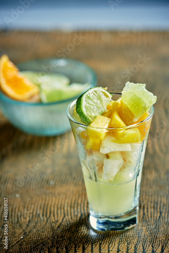 Set of different pieces fresh fruits in glass