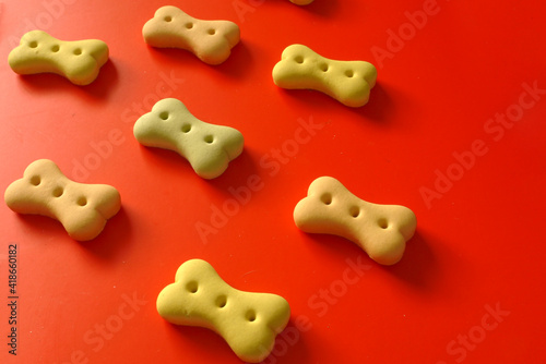 Puppy bone shaped biscuits on the background cookie