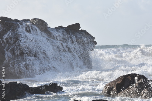 The sea demostrating its power against the cliffs photo