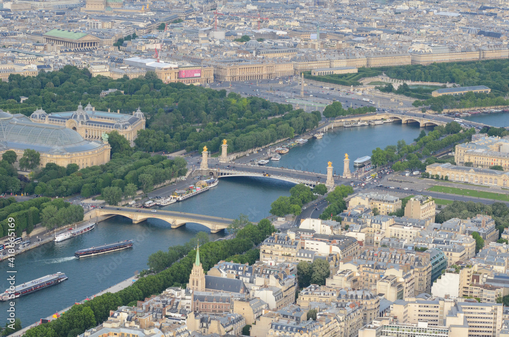 Obraz premium Aerial View from Paris, France. With its cinemas, cafes, luxury specialty stores and horse chestnut trees, Avenue des Champs-Élysées is one of the most famous streets in the world ad Sene River