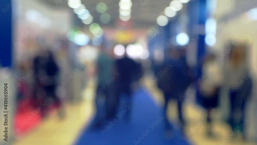 blurred background on a business theme.many people in a modern business center. blurred background on a business theme.many people in a modern business center.