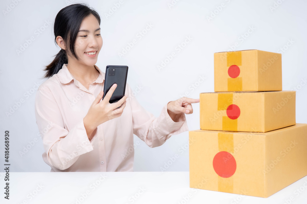 Asia woman Start up for Business Online. People with online shopping SME entrepreneur or freelance working concept. Banner size Asia woman Start up for Business Online. People with online shopping SME entrepreneur or freelance working concept. Banner size