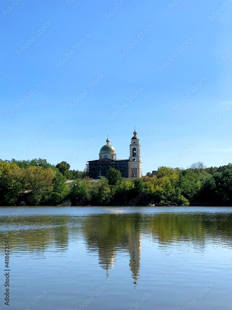 View from the lake on Holy Transfiguration Church, Orthodox Christian temple in Talova Balka village near Svitlovodsk city, Kirovograd region, Ukraine. Now on reconstruction. Mobile photo