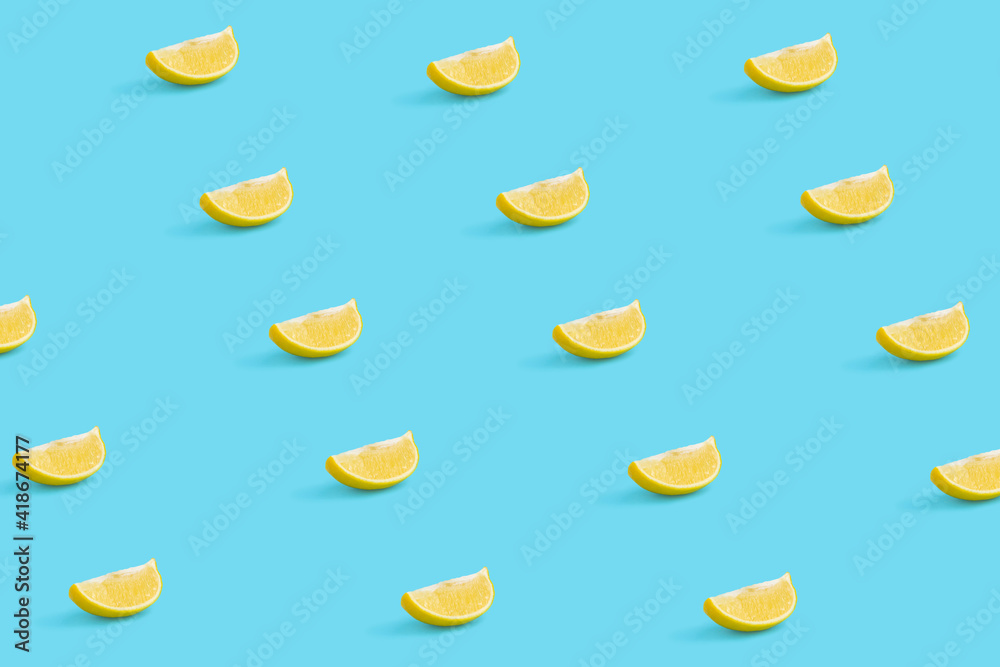 Naklejka premium Creative summer fruit pattern made of lemon slice on pastel blue background