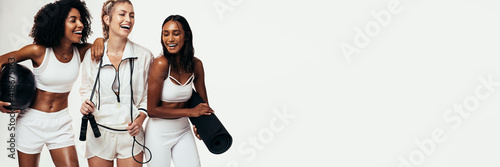 Принти на полотні Group of women in sportswear on panoramic white background