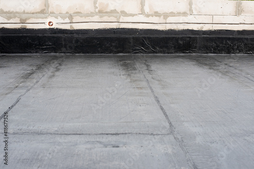 Waterproofing flat roof terrace with roll bitumen photo