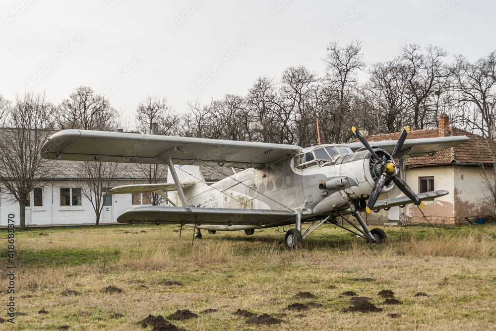 Parked aircraft - Antonov (PZL-Mielec) An-2R, off the runway at the Aero Club Novi Sad, Serbia. Parked aircraft - Antonov (PZL-Mielec) An-2R, off the runway at the Aero Club Novi Sad, Serbia.