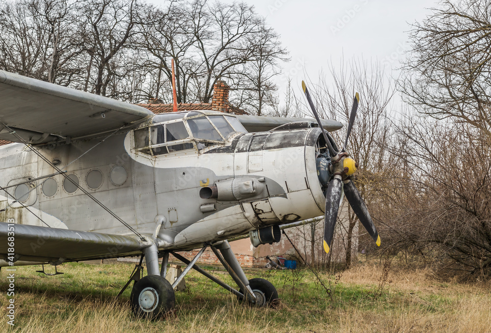 Parked aircraft - Antonov (PZL-Mielec) An-2R, off the runway at the Aero Club Novi Sad, Serbia. Parked aircraft - Antonov (PZL-Mielec) An-2R, off the runway at the Aero Club Novi Sad, Serbia.