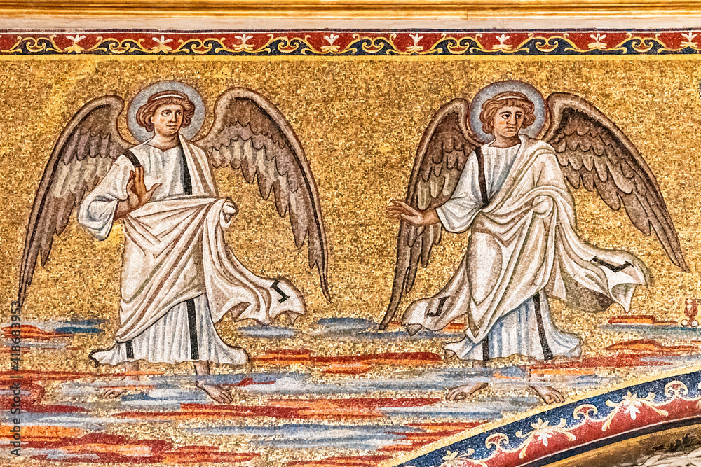 Detail of religious golden mosaic showing angels on the wall of catholic church in Rome