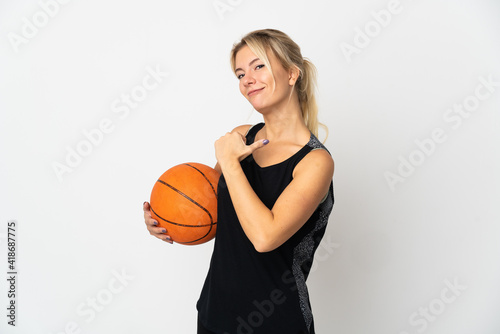 Young Russian woman playing basketball isolated on white background proud and self-satisfied