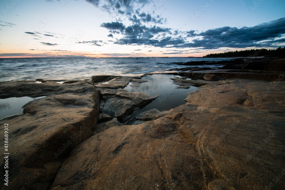 sunset over rocky coast of Faboda, Finland sunset over rocky coast of Faboda, Finland