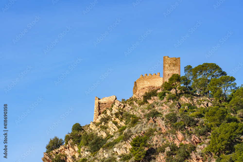 Ruined castle at the top of a mountain. Castell de Serra, (Serra's Castle) Valencia, Spain.