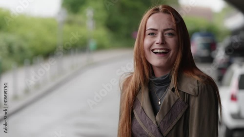 [4k] happy surprised beautiful young ginger woman can't believe her luck smiling and biting her lips
