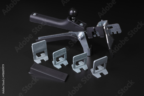 Tiler and tiler leveler kit with pliers, wedges and wedges
