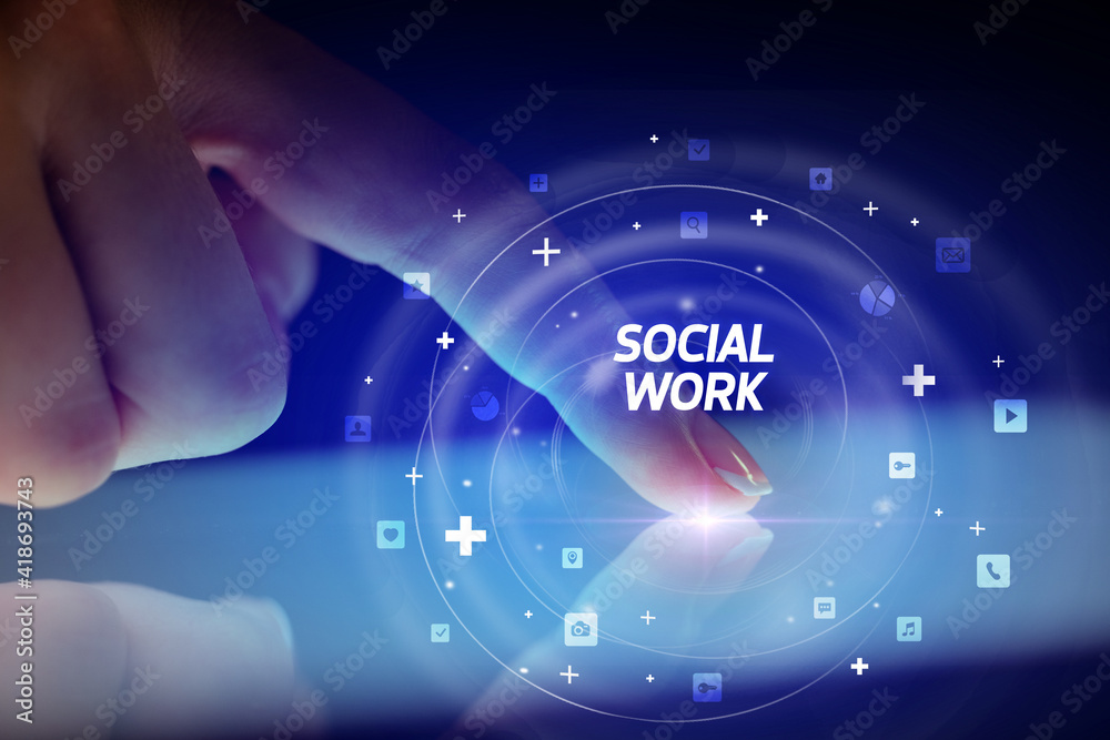 Finger touching tablet with social media icons and SOCIAL WORK