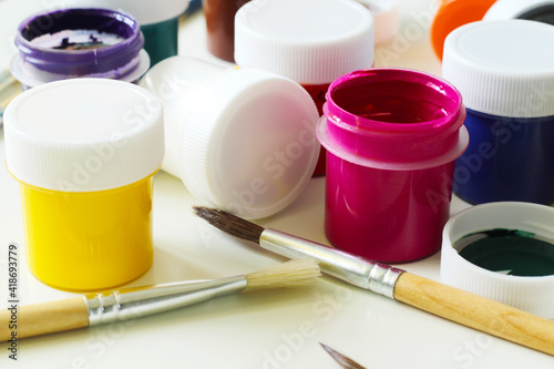 painting tools, mix of gouache paints and paintbrushes