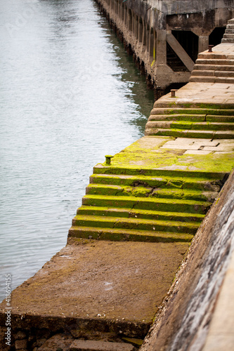 Escaleras con verdín en el puerto de Santander, Cantabria (España) photo