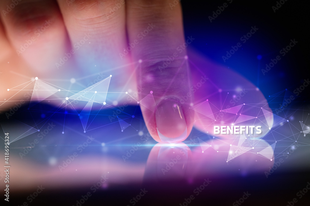 Finger touching tablet with BENEFITS inscription, business concept Finger touching tablet with BENEFITS inscription, business concept