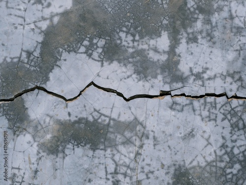 Фотография The ground was cracked because of being hit.