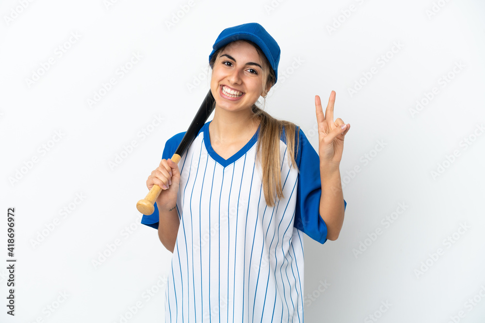Young caucasian woman playing baseball isolated on white background smiling and showing victory sign Young caucasian woman playing baseball isolated on white background smiling and showing victory sign