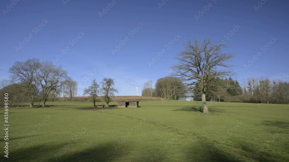 Green meadow with blue sky and aerogenerator. Green energy. Green meadow with blue sky and aerogenerator. Green energy.