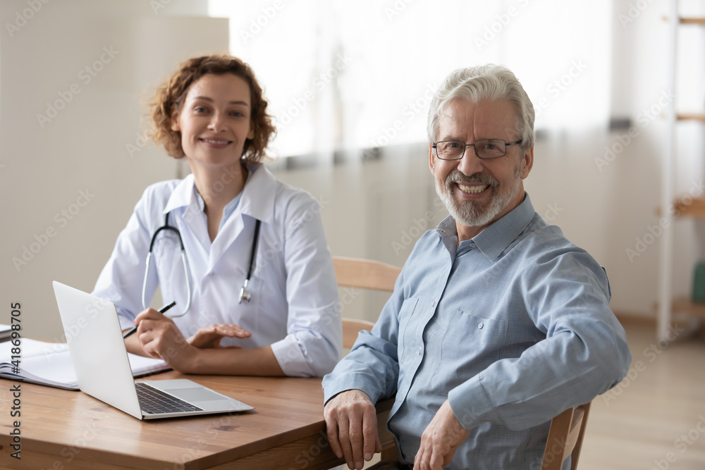Obraz premium Portrait of happy elderly Caucasian male patient feel satisfied with good quality service in clinic. Smiling mature man excited with consultation with female doctor in hospital. Geriatric concept.