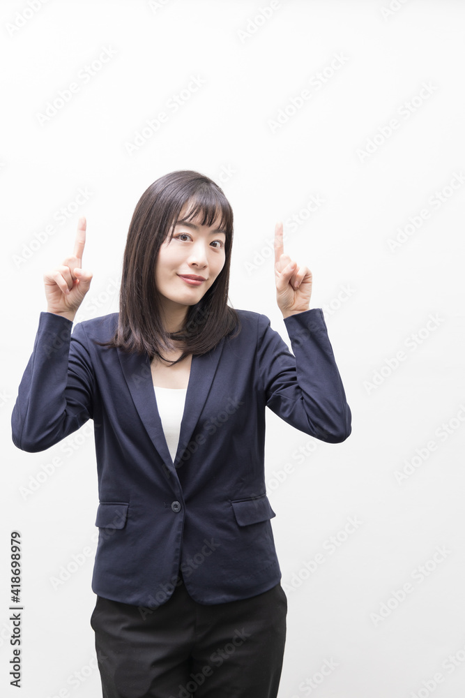 Woman standing with her index finger up (gesture) Woman standing with her index finger up (gesture)