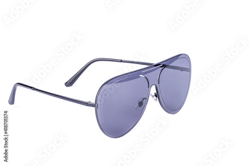 Blue plastic sunglasses isolated on white background. Close up. Copy space.