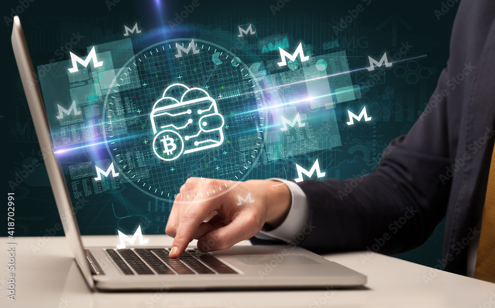 business hand working in stock market with bitcoin wallet icons coming out from laptop screen business hand working in stock market with bitcoin wallet icons coming out from laptop screen