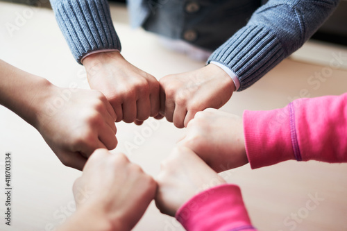 kids hands in circle together, friendship and peace concept