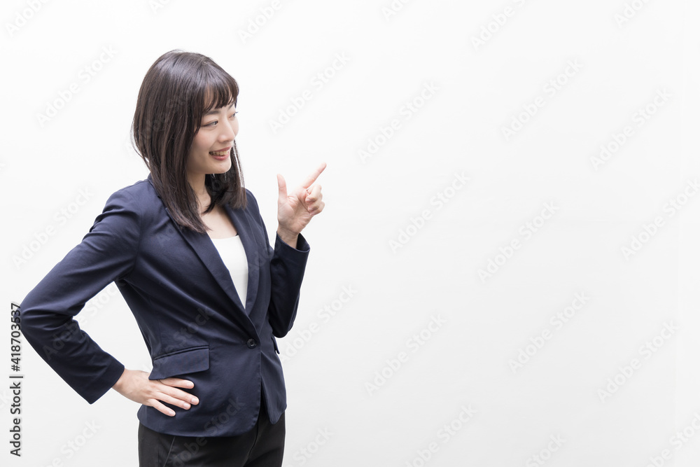 Woman standing with her index finger up (gesture) Woman standing with her index finger up (gesture)