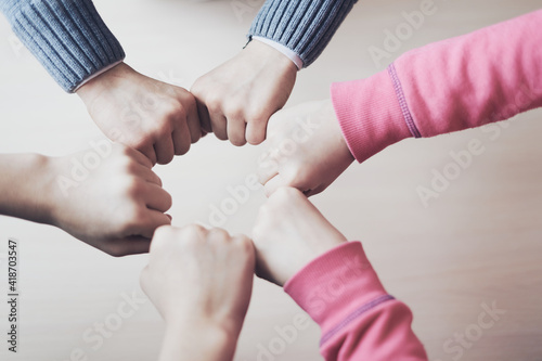 kids hands in circle together, friendship and peace concept