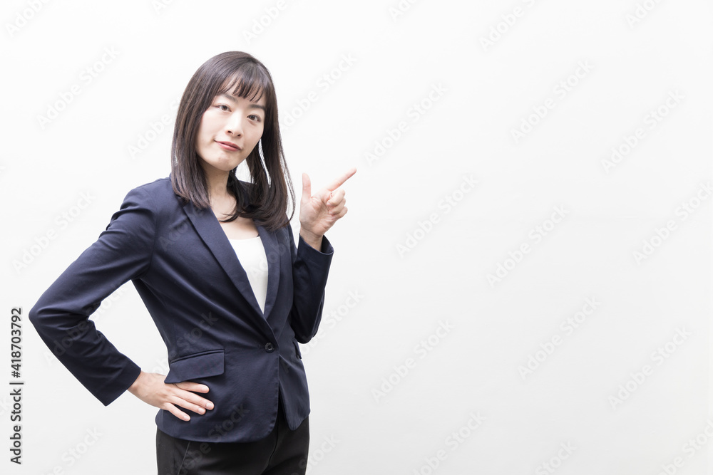 Woman standing with her index finger up (gesture) Woman standing with her index finger up (gesture)