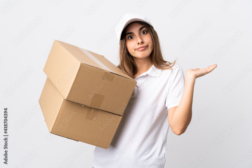 Young delivery woman over isolated white background making doubts gesture Young delivery woman over isolated white background making doubts gesture