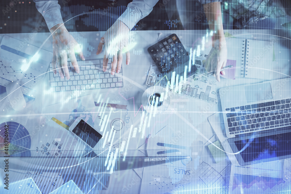 Double exposure of man and woman working together and financial chart hologram drawing. market analysis concept. Computer background. Top View. Double exposure of man and woman working together and financial chart hologram drawing. market analysis concept. Computer background. Top View.
