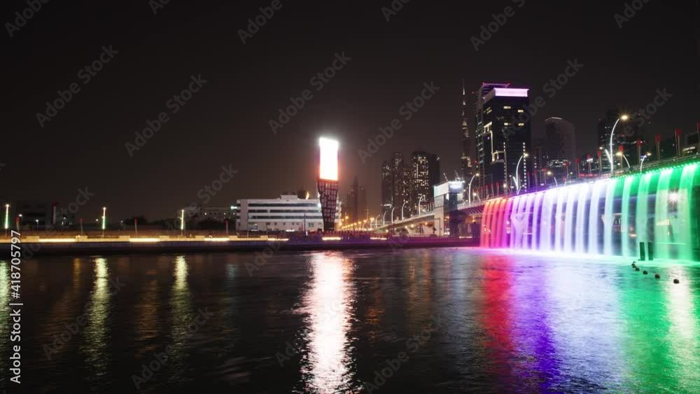 Night timelapse of a modern city, full of skyscrapers. High rise skyline, Dubai city. Development and luxury, high buildings and urban city movement. Night timelapse of a modern city, full of skyscrapers. High rise skyline, Dubai city. Development and luxury, high buildings and urban city movement.