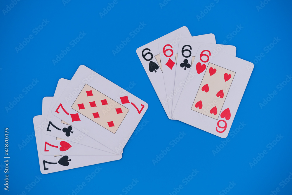 Obraz premium Playing cards showing seven and six for hearts, clubs, spades and diamonds on blue background. Gambling concept