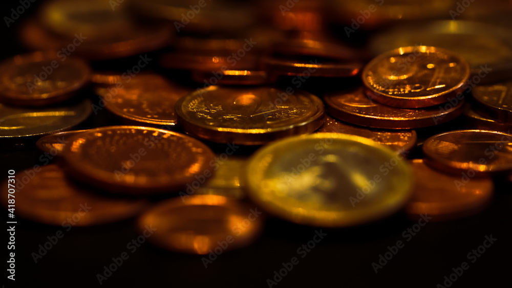 Shiny metal coins, shallow depth of field. Wealth and finance concept Shiny metal coins, shallow depth of field. Wealth and finance concept