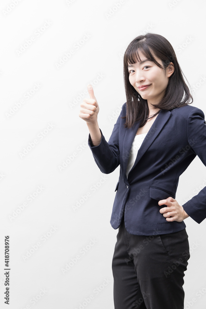 Woman who thumbs up with a smile (gesture) Woman who thumbs up with a smile (gesture)