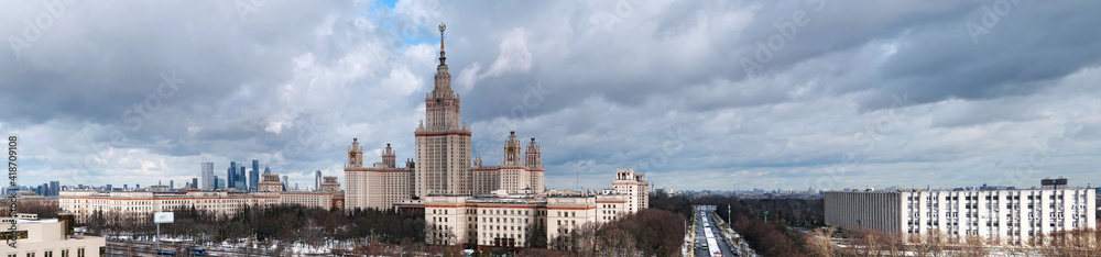 Panoramic aerial view of campus buildings of famous university in sunset Moscow under dramatic cloudy sky Panoramic aerial view of campus buildings of famous university in sunset Moscow under dramatic cloudy sky