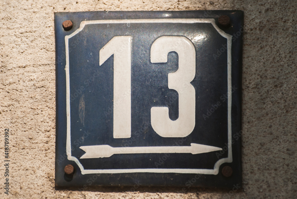 Weathered grunge square metal enamelled plate of number of street address with number 13 Weathered grunge square metal enamelled plate of number of street address with number 13