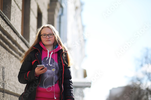 Girl on a walk in sunny weather photo