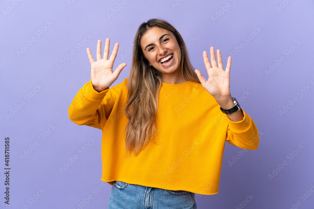Young hispanic woman over isolated purple background counting ten with fingers