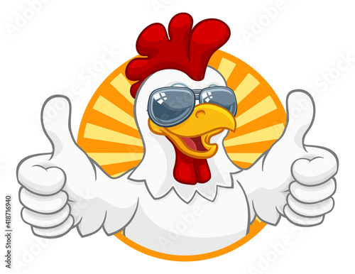 A chicken rooster cockerel bird cartoon character in cool shades or sunglasses giving a double thumbs up
