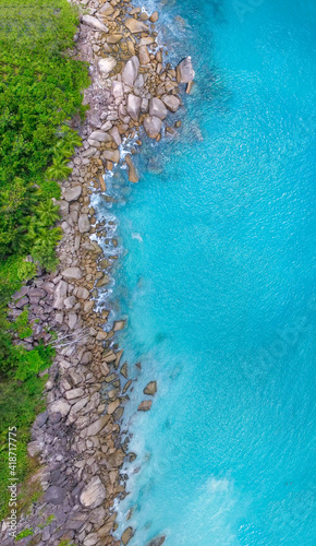Overhead aerial view of Seychelles Beach with rocks, ocean landscape