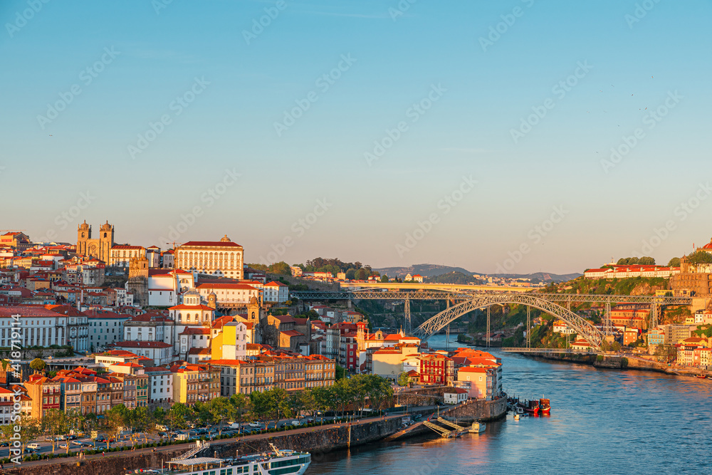 Aerial view on Porto city center and the Douro river with Dom Luis bridge in Portugal on sunset
