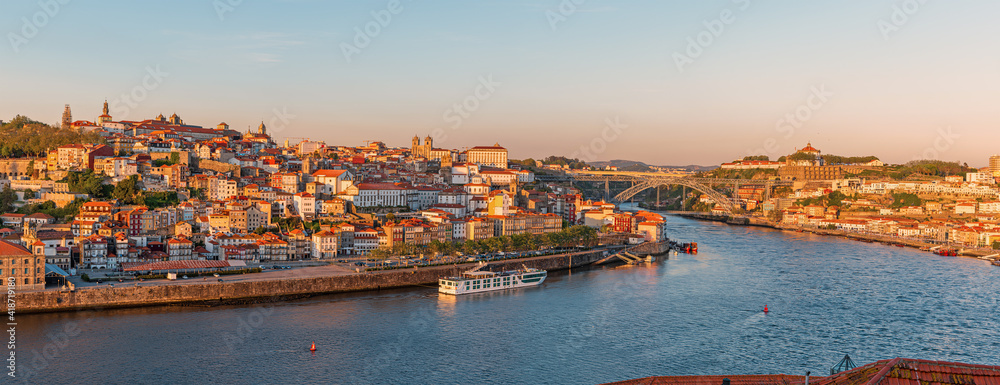 Panoramic view on Porto city center and the Douro river with Dom Luis bridge in Portugal on sunset