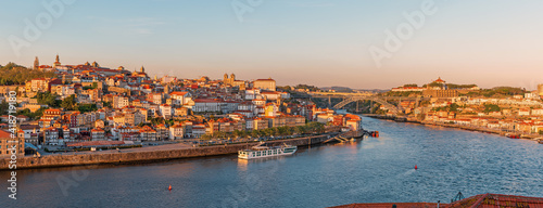Panoramic view on Porto city center and the Douro river with Dom Luis bridge in Portugal on sunset