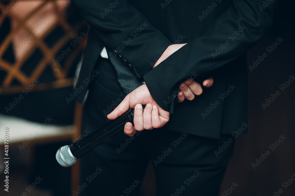 Man Showman Speaker Holding Microphone Behind His Back Business Conference Concept