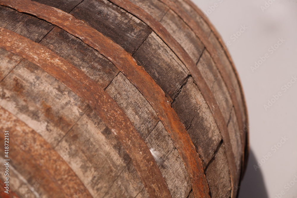 Old beer barrel. Background of a trunk and a worn old wooden table. Old beer barrel. Background of a trunk and a worn old wooden table.